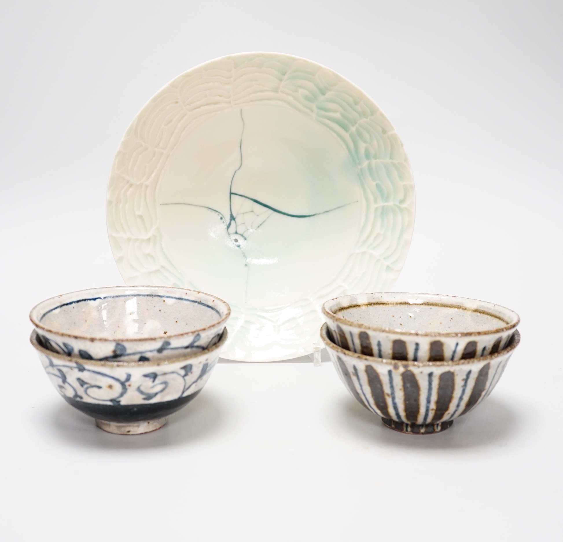 Two pairs of Japanese studio pottery bowls, a European studio bowl and similar ceramic mask raised on hexagonal base, the largest 33cm high